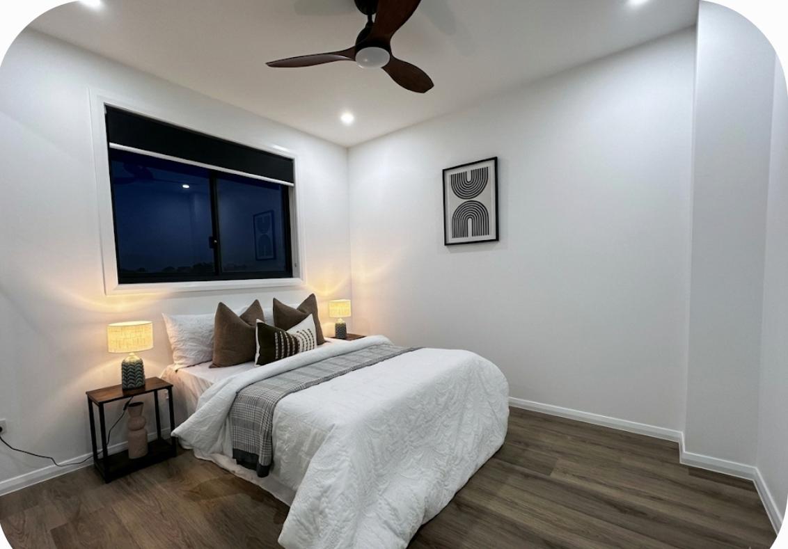 Crisp Modern Bedroom with Ceiling Fan